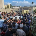 Relatives of Palestinians, who lost their lives following the Israeli attack on Khan Yunis, mourn as dead bodies are taken from the morgue at Nasser Hospital for burial in Khan Yunis, Gaza