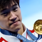 Paris 2024 Olympics - Swimming - Men's 100m Freestyle Victory Ceremony - Paris La Defense Arena, Nanterre, France - July 31, 2024. Gold medallist Zhanle Pan of China celebrates after winning the race and setting a new world record. REUTERS/Ueslei Marcelino 