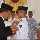 Bupati Humbang Hasundutan, Dosmar Banjarnahor, SE, secara resmi mengukuhkan Pasukan Pengibar Bendera Pusaka (Paskibraka) Kabupaten Humbang Hasundutan