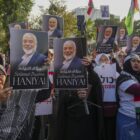 Protesters hold a poster of Hamas leader Ismail Haniyeh, who was assassinated in Tehran, during a rally in support of the Palestinians in Gaza, outside the US Embassy in Jakarta, Indonesia, Saturday, Aug. 3, 2024. (AP Photo/Tatan Syuflana)