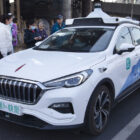 Beijing residents use the robotaxi service provided by the technology giant Baidu Inc. (Photo by Jiao Hongtao /for China Daily)